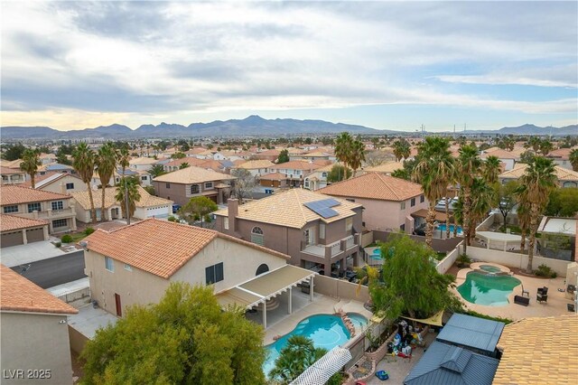 birds eye view of property with a residential view and a mountain view