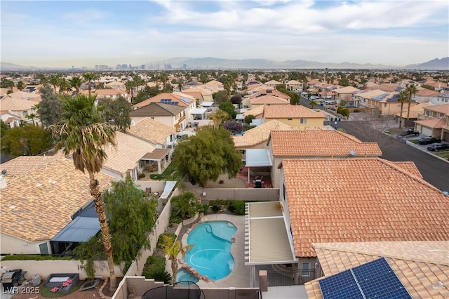 drone / aerial view with a residential view and a mountain view