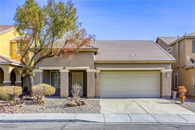 view of front of property with a garage