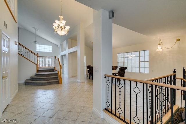 5416 Lochmor Ave, Las Vegas, NV 89130 - staircase with a chandelier, tile patterned flooring, high vaulted ceiling, and ceiling fan