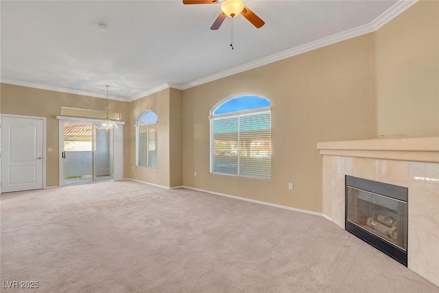 unfurnished living room featuring ornamental molding, light carpet, and a fireplace