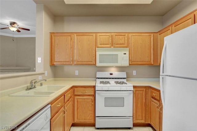 kitchen with light tile patterned flooring, sink, crown molding, white appliances, and ceiling fan