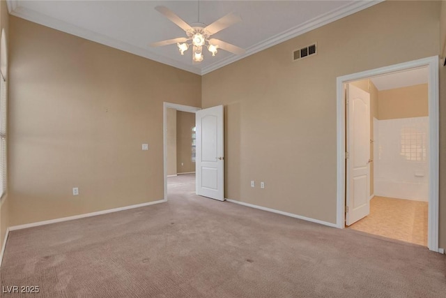 unfurnished room featuring crown molding, light colored carpet, and ceiling fan