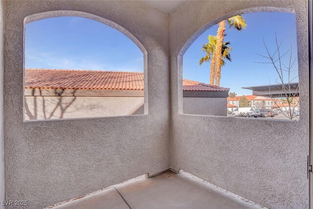 view of patio featuring a balcony