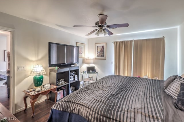 bedroom featuring ceiling fan and dark hardwood / wood-style flooring