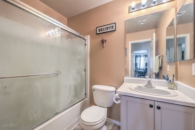 full bathroom featuring shower / bath combination with glass door, vanity, and toilet