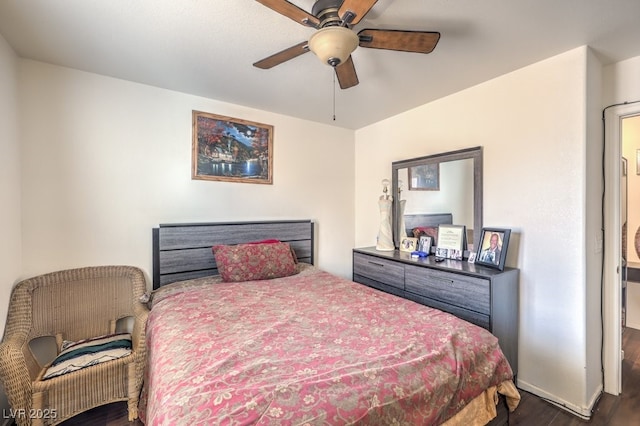 bedroom with ceiling fan and dark hardwood / wood-style floors