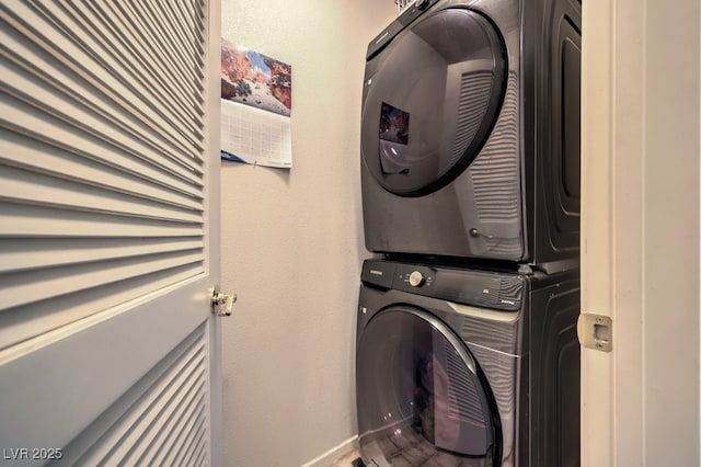 laundry room featuring stacked washer / dryer