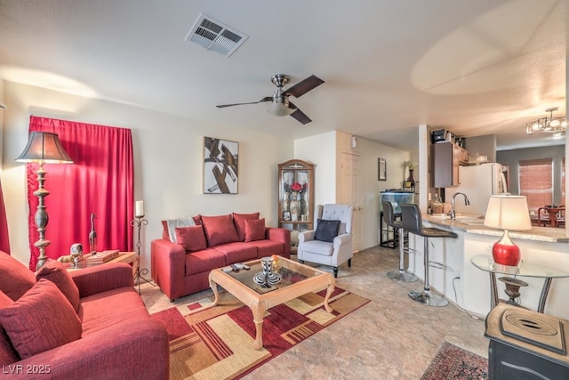 living room with sink and ceiling fan