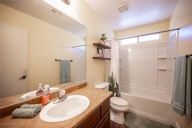 full bathroom with vanity, shower / bathtub combination with curtain, and toilet