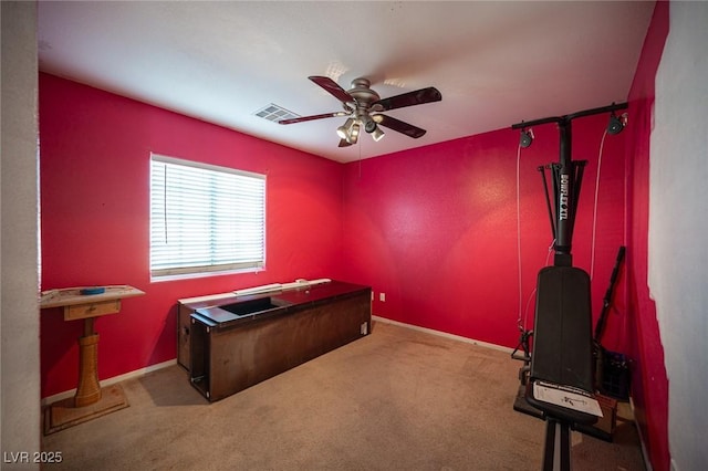 carpeted office with ceiling fan