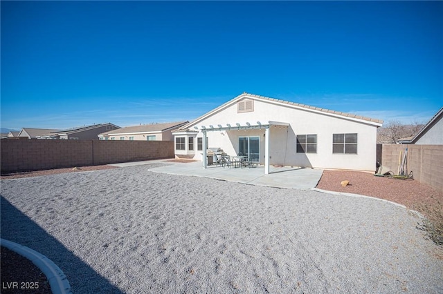 rear view of house with a patio area