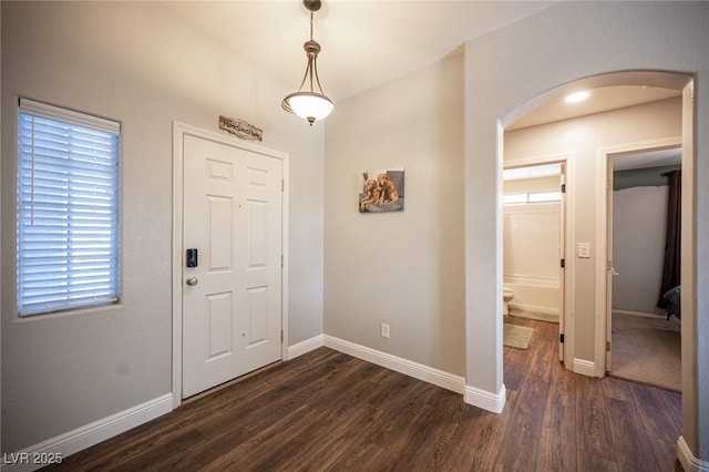 entrance foyer featuring dark hardwood / wood-style flooring