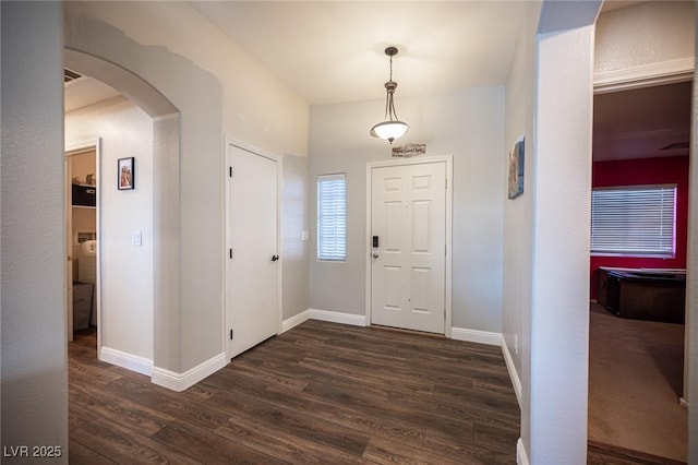 foyer entrance featuring dark hardwood / wood-style floors