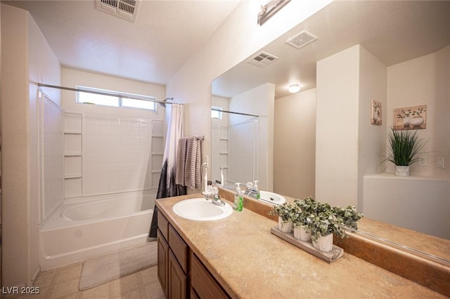 bathroom with shower / tub combo and vanity