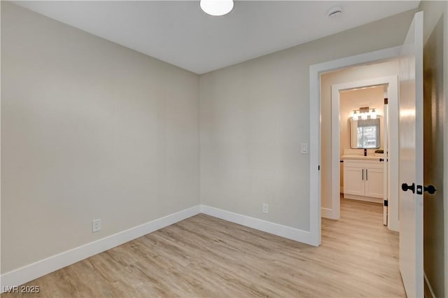 4512 Mark Ave, Las Vegas, NV 89108 - empty room with light wood finished floors and a smoke detector