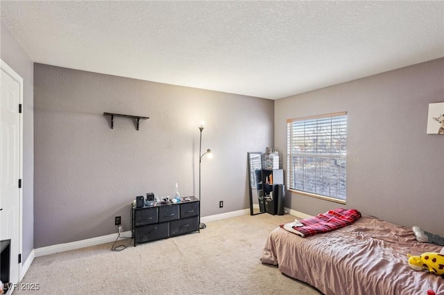 carpeted bedroom with a textured ceiling