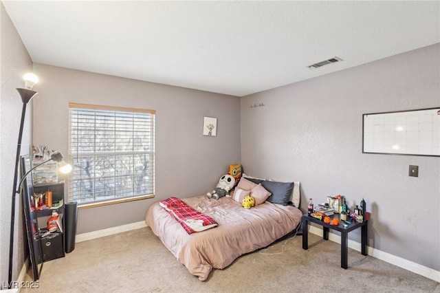 bedroom featuring light colored carpet