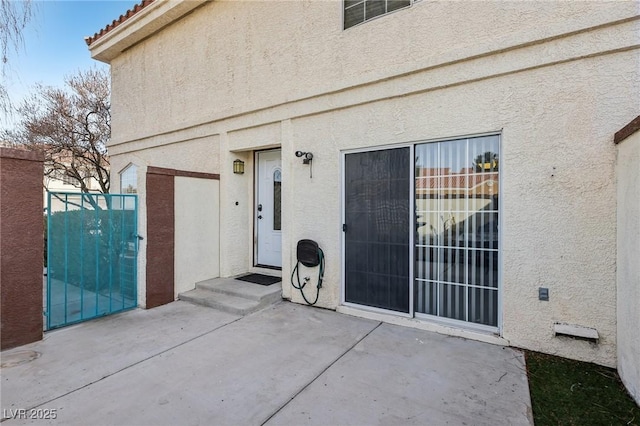 entrance to property with a patio area