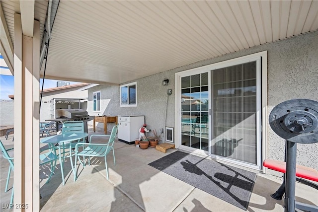 view of patio featuring a grill