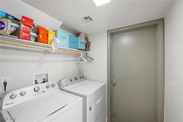 laundry room featuring washer and clothes dryer