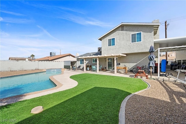 back of property featuring a fenced in pool, a patio, a lawn, and a pergola