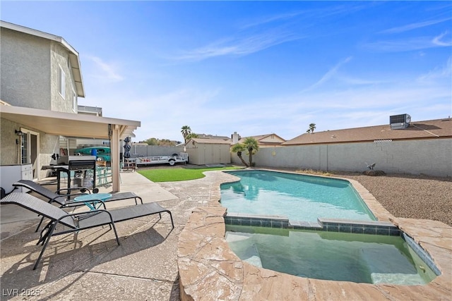 view of swimming pool with central AC unit and a patio