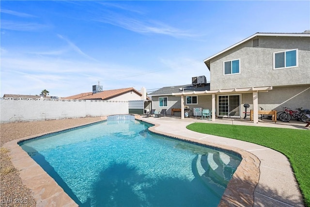 view of swimming pool with a yard, cooling unit, and a patio area