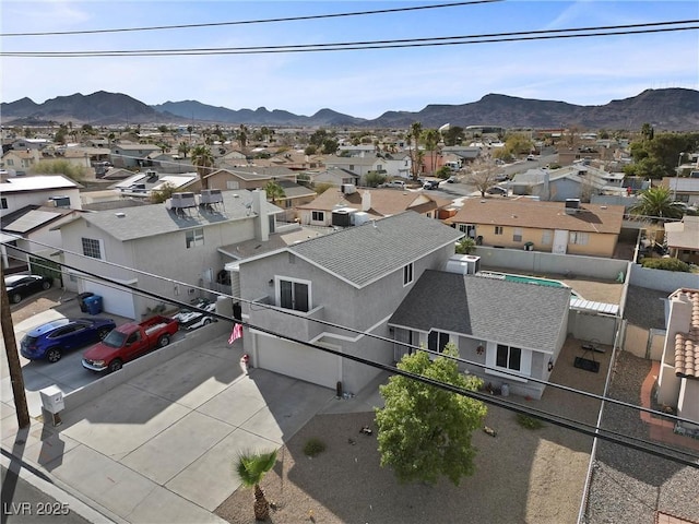 birds eye view of property featuring a mountain view