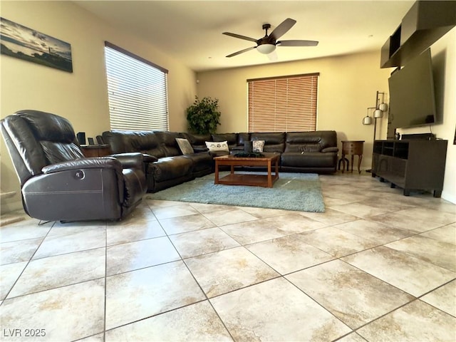 living room featuring light tile patterned flooring and ceiling fan