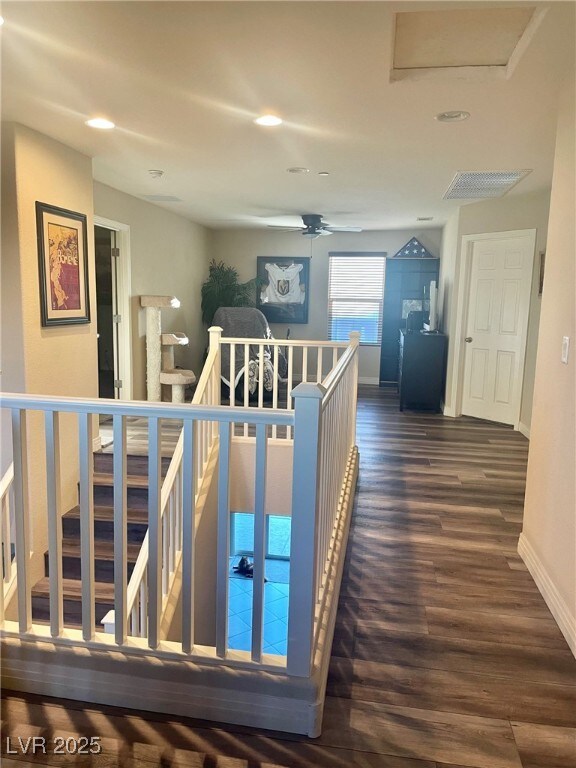 hallway with dark hardwood / wood-style floors