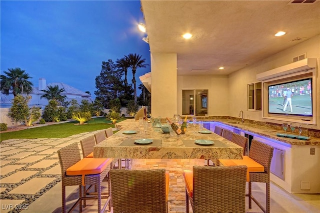 view of patio / terrace featuring a wet bar