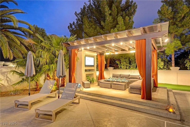 patio terrace at dusk featuring a pergola and outdoor lounge area