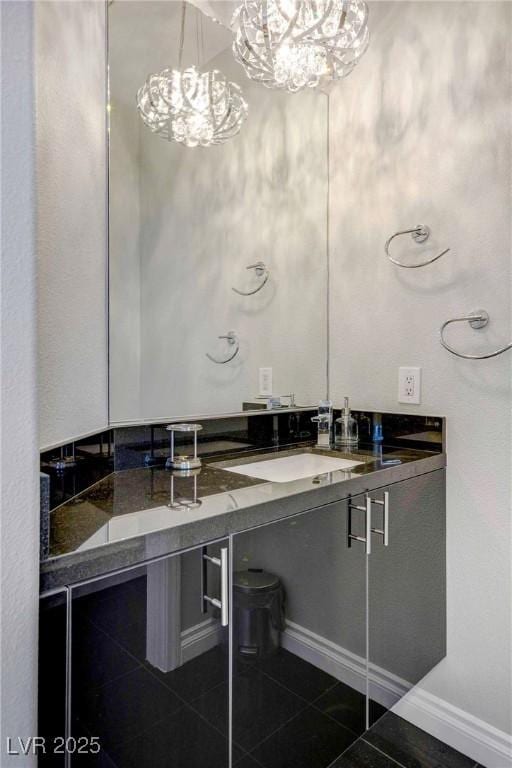 bathroom with tile patterned flooring and vanity