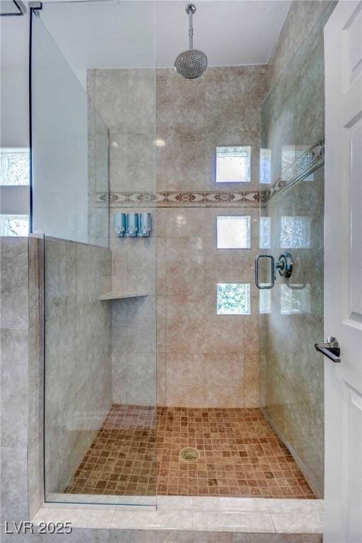 bathroom featuring an enclosed shower