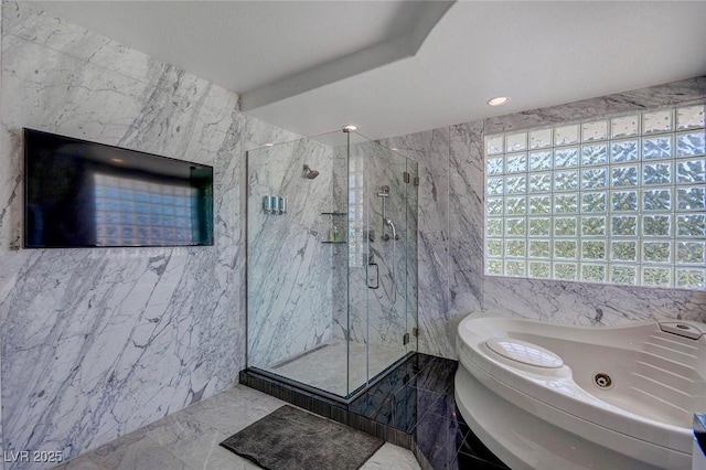 bathroom with plus walk in shower and tile walls