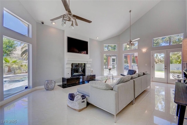 living room featuring french doors, ceiling fan, light tile patterned flooring, and high vaulted ceiling