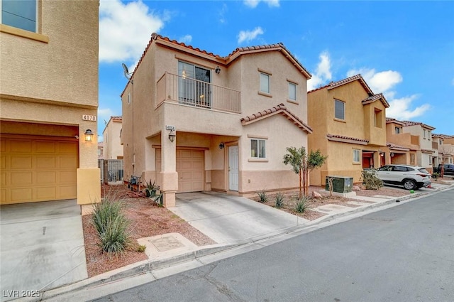 view of front of home with a garage and a balcony