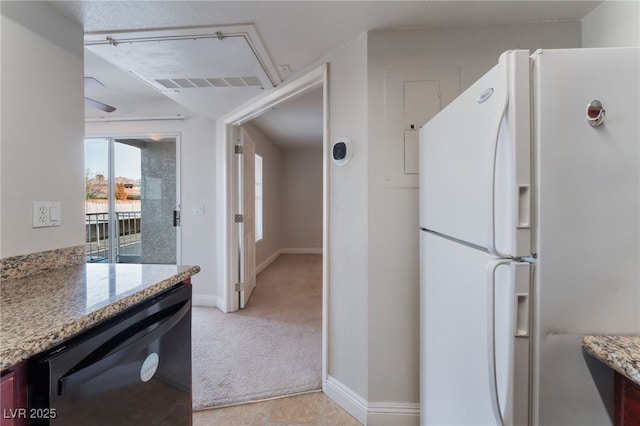 kitchen featuring stone counters, white fridge, black dishwasher, and light colored carpet