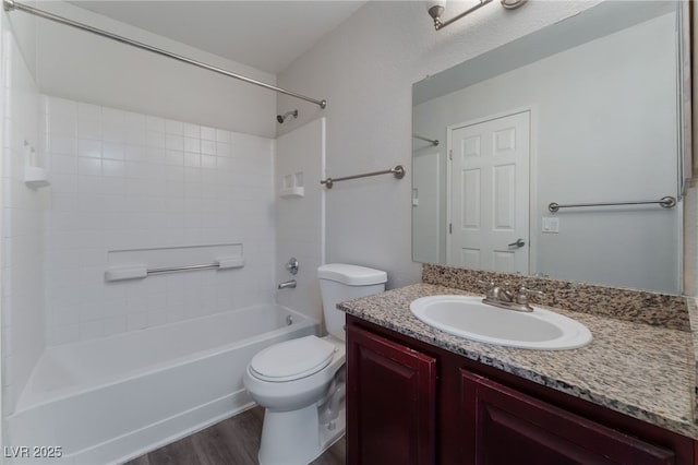 full bathroom with shower / tub combination, hardwood / wood-style floors, vanity, and toilet