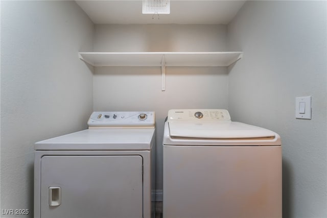 laundry area with washing machine and dryer