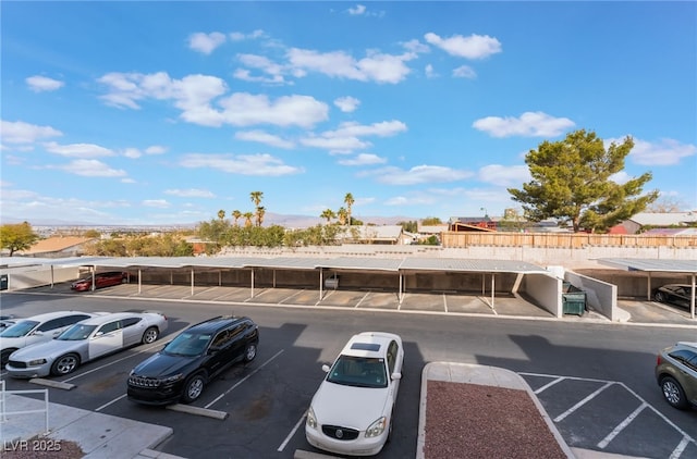 view of vehicle parking featuring a carport