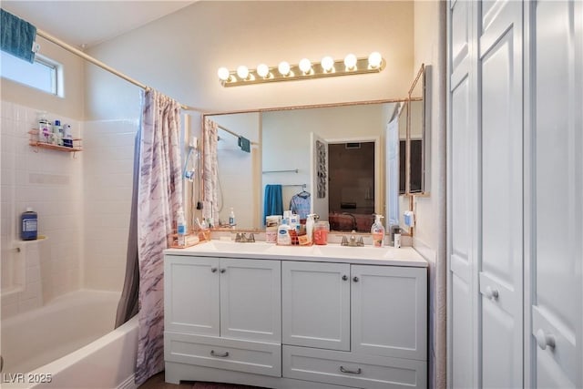 bathroom featuring shower / bath combo and vanity