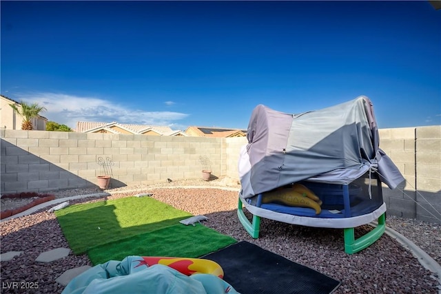 view of yard featuring a trampoline