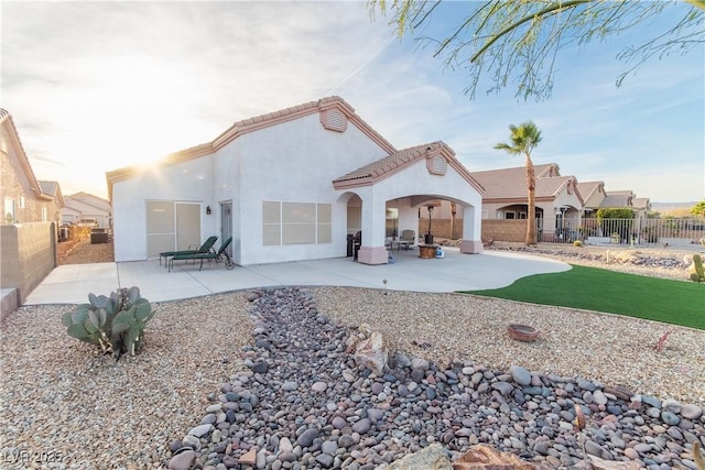 rear view of house with a patio