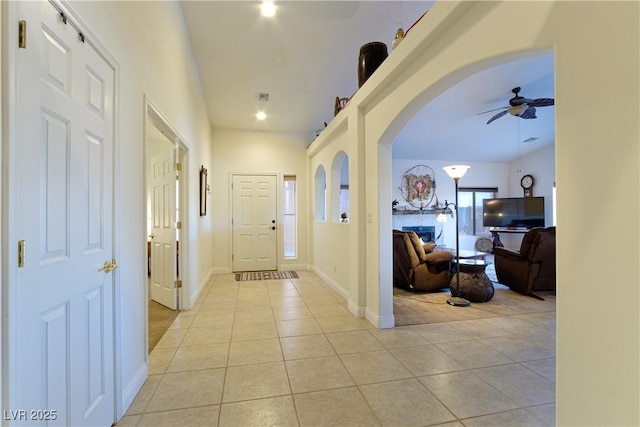 interior space with ceiling fan