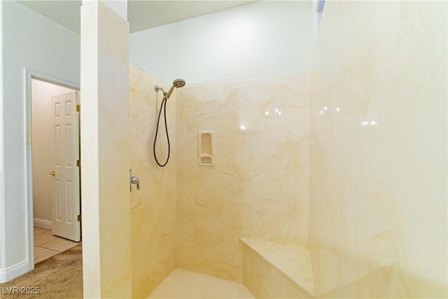 bathroom with tiled shower