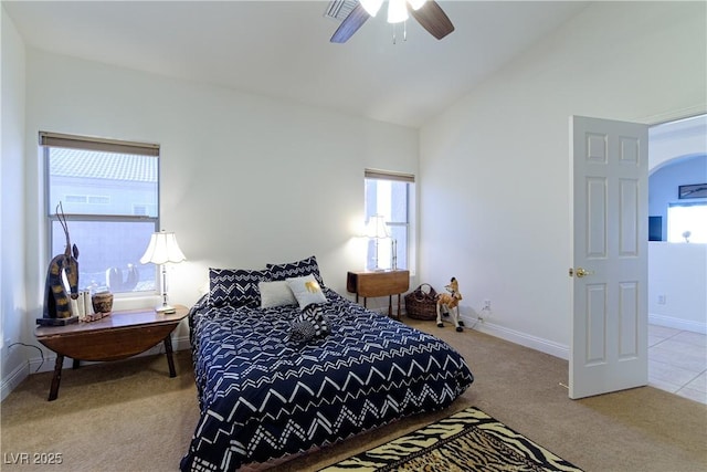 bedroom featuring lofted ceiling, light carpet, and ceiling fan