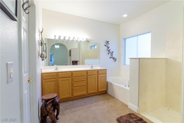 bathroom with vanity and plus walk in shower