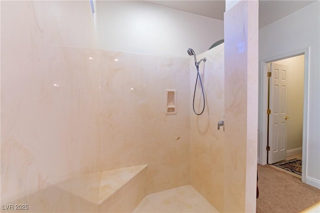 bathroom with tiled shower